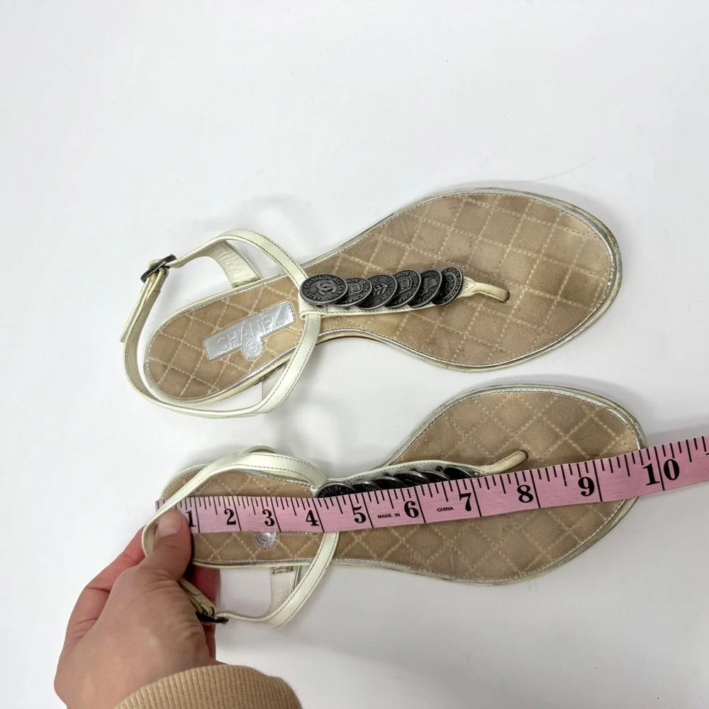 CHANEL White Leather Thong Sandals with Stacked Silver Coin Medallions